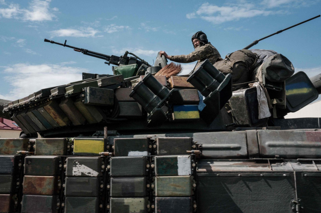 &lt;p&gt;A Ukrainian soldier sits on a tank carryied by a transporter near Bakhmut, eastern Ukraine, on May 12, 2022, amid the Russian invasion of Ukraine. (Photo by Yasuyoshi CHIBA/AFP)&lt;/p&gt;
