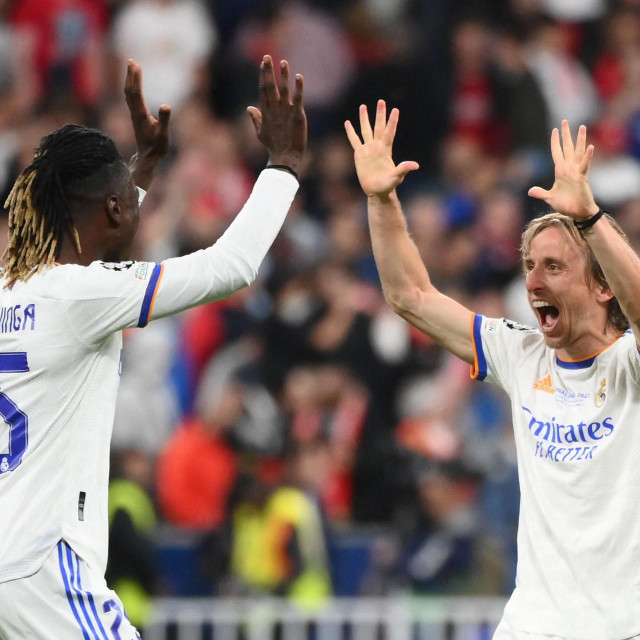 &lt;p&gt;Real Madrid&amp;#39;s Angolan midfielder Eduardo Camavinga (L) celebrates with Real Madrid&amp;#39;s Croatian midfielder Luka Modric (R) after their team won the UEFA Champions League final football match between Liverpool and Real Madrid at the Stade de France in Saint-Denis, north of Paris, on May 28, 2022. (Photo by FRANCK FIFE/AFP)&lt;/p&gt;