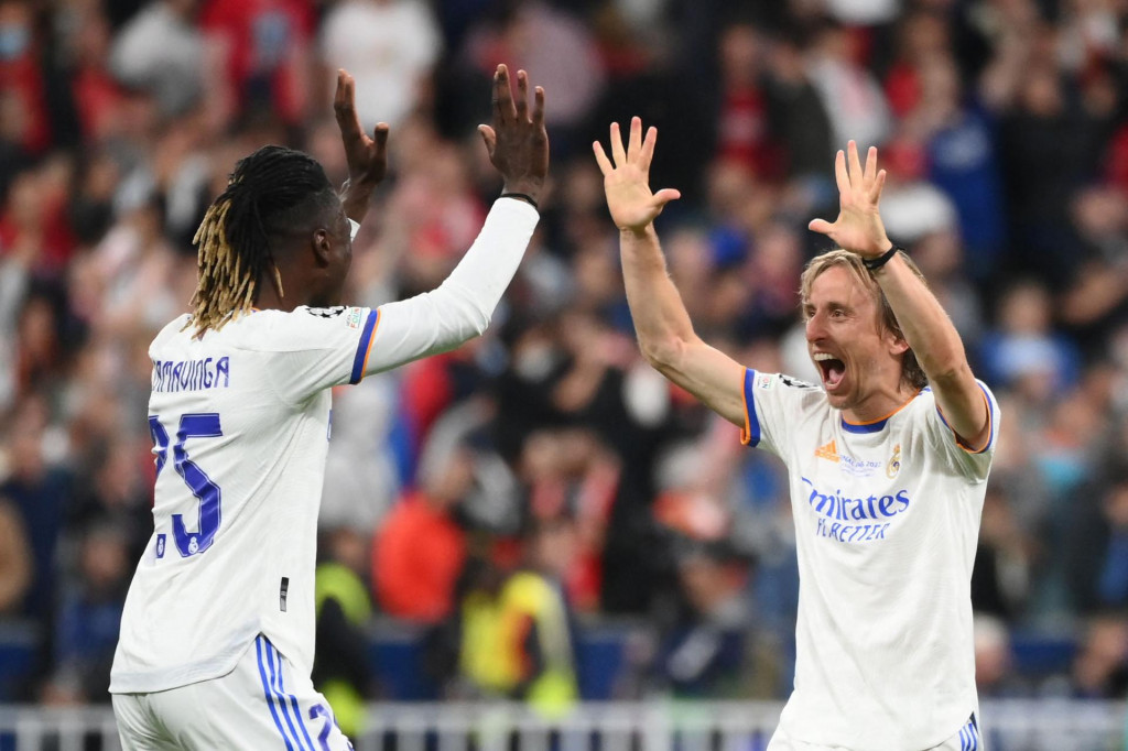 &lt;p&gt;Real Madrid&amp;#39;s Angolan midfielder Eduardo Camavinga (L) celebrates with Real Madrid&amp;#39;s Croatian midfielder Luka Modric (R) after their team won the UEFA Champions League final football match between Liverpool and Real Madrid at the Stade de France in Saint-Denis, north of Paris, on May 28, 2022. (Photo by FRANCK FIFE/AFP)&lt;/p&gt;