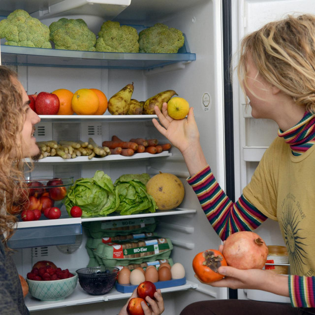 &lt;p&gt;13 June 2019, Rhineland-Palatinate, Trier: Lenny (l) and Freja take fruit from their fridge, which they have ”fished” from the waste bins of a supermarket. They ”contain” still edible food. (to dpa: Two, the ”containern”: ”We no longer go shopping”) Photo: Harald Tittel/dpa (Photo by HARALD TITTEL/DPA/dpa Picture-Alliance via AFP)&lt;/p&gt;