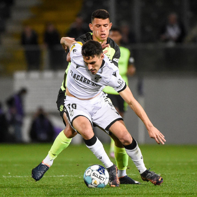 &lt;p&gt;Vitoria Guimaraes&amp;#39; Portuguese midfielder Andre Almeida (Front) fights for the ball with Sporting Lisbon&amp;#39;s Slovenian forward Andraz Sporar during the Portuguese League football match between Vitoria Guimaraes SC and Sporting CP at the Dom Afonso Henriques stadium in Guimaraes on March 19, 2022. (Photo by MIGUEL RIOPA/AFP)&lt;/p&gt;