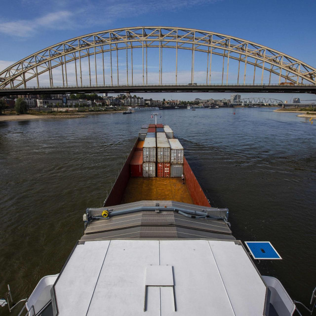 &lt;p&gt;A picture taken from an inland vessel loaded with containers shows shipping on its way to Germany on the Rhine River near Lobith, on August 22, 2022. - Due to the low water levels in the Rhine, inland vessels can carry less cargo. In Millingen, the Netherlands, 22 August 2022. (Photo by Vincent Jannink/ANP/AFP)/Netherlands OUT&lt;/p&gt;