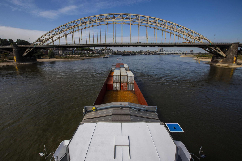 &lt;p&gt;A picture taken from an inland vessel loaded with containers shows shipping on its way to Germany on the Rhine River near Lobith, on August 22, 2022. - Due to the low water levels in the Rhine, inland vessels can carry less cargo. In Millingen, the Netherlands, 22 August 2022. (Photo by Vincent Jannink/ANP/AFP)/Netherlands OUT&lt;/p&gt;