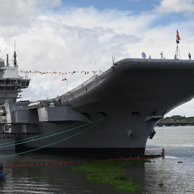 &lt;p&gt;Indian Navy officers and attendees stand on a deck of the Indian indigenous aircraft carrier INS Vikrant during its commissioning at Cochin Shipyard in Kochi on September 2, 2022 - India debuted its first locally made aircraft carrier on September 2, a milestone in government efforts to reduce its dependence on foreign arms and counter China‘s growing military assertiveness in the region. (Photo by Arun SANKAR/AFP)&lt;/p&gt;