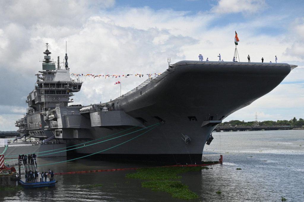 &lt;p&gt;Indian Navy officers and attendees stand on a deck of the Indian indigenous aircraft carrier INS Vikrant during its commissioning at Cochin Shipyard in Kochi on September 2, 2022 - India debuted its first locally made aircraft carrier on September 2, a milestone in government efforts to reduce its dependence on foreign arms and counter China‘s growing military assertiveness in the region. (Photo by Arun SANKAR/AFP)&lt;/p&gt;