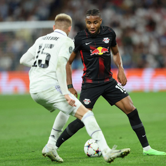 &lt;p&gt;Real Madrid‘s Uruguayan midfielder Federico Valverde (L) fights for the ball with Leipzig‘s French midfielder Christopher Nkunku during the UEFA Champions League, Group F, first leg football match between Real Madrid and RB Leipzig at the Santiago Bernabeu stadium in Madrid on September 14, 2022. (Photo by Thomas COEX/AFP)&lt;/p&gt;