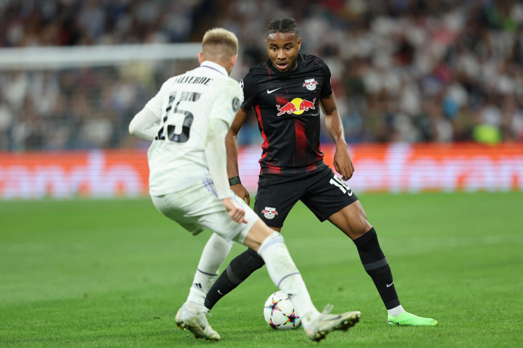 &lt;p&gt;Real Madrid‘s Uruguayan midfielder Federico Valverde (L) fights for the ball with Leipzig‘s French midfielder Christopher Nkunku during the UEFA Champions League, Group F, first leg football match between Real Madrid and RB Leipzig at the Santiago Bernabeu stadium in Madrid on September 14, 2022. (Photo by Thomas COEX/AFP)&lt;/p&gt;