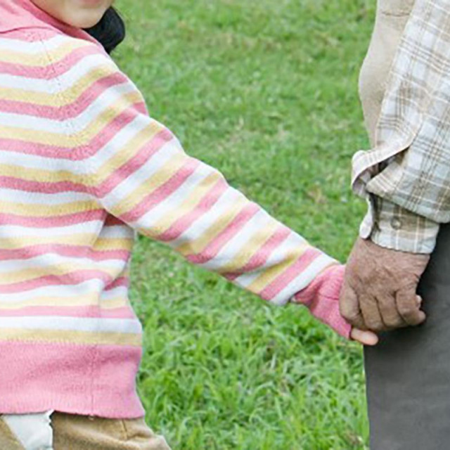 &lt;p&gt;Girl walking hand in hand with grandparents (Photo by James Hardy/AltoPress/PhotoAlto via AFP)&lt;/p&gt;