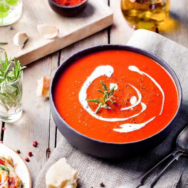 &lt;p&gt;Tomato, red pepper soup, sauce with olive oil, rosemary and smoked paprika on a wooden background.&lt;/p&gt;
