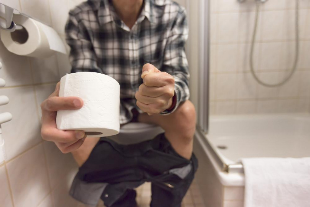 &lt;p&gt;Close up of Man sitting in toilet feeling unhappy and holds toilet paper roll diarrhea constipation,Health concept&lt;/p&gt;
