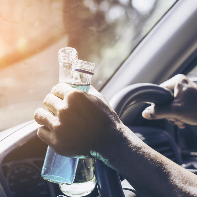 &lt;p&gt;Asian man drinking and driving. Dangerous driving concept.&lt;/p&gt;