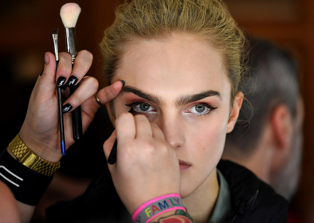 &lt;p&gt;Models have their hair and make-up prepared before presenting creations by fashion house Richard Quinn during the catwalk show for their Autumn/Winter 2020 collection on the second day of London Fashion Week in London on February 15, 2020. (Photo by Ben STANSALL/AFP)&lt;/p&gt;