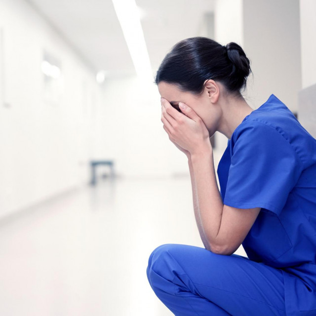 &lt;p&gt;people, medicine, healthcare and sorrow concept - sad or crying female nurse at hospital corridor&lt;/p&gt;