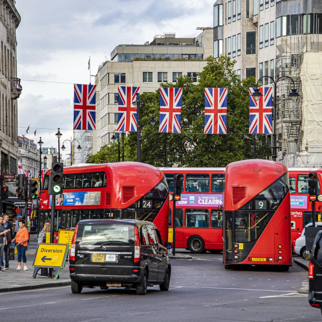 &lt;p&gt;The flag of Great Britain waving in the city of London over a road with traffic like buses, taxi, cab and bicycle, in the capital of the United Kingdom. The flag, commonly known as King‘s Colours, the first Union Flag, the Union Jack, or the British flag is the flag of the United Kingdom. The flag consists of the red cross of Saint George, patron saint of England, superimposed on the Saltire of Saint Andrew, patron saint of Scotland. August 25, 2022 - London, United Kingdom (Photo by Nicolas Economou/NurPhoto) (Photo by Nicolas Economou/NurPhoto/NurPhoto via AFP)&lt;/p&gt;