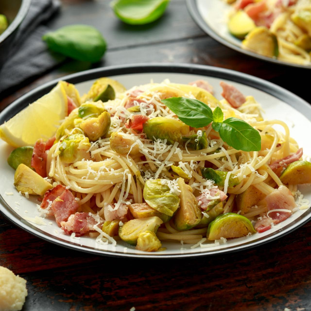 &lt;p&gt;Homemade Brussels sprouts, bacon, pancetta pasta with parmesan cheese. On wooden table&lt;/p&gt;