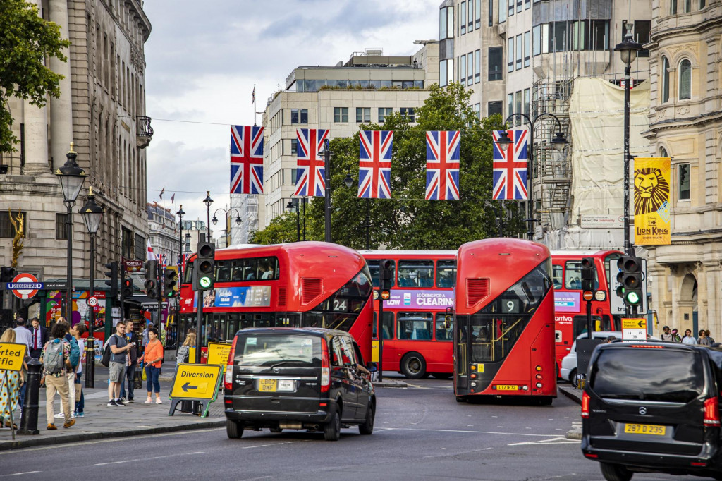 &lt;p&gt;The flag of Great Britain waving in the city of London over a road with traffic like buses, taxi, cab and bicycle, in the capital of the United Kingdom. The flag, commonly known as King‘s Colours, the first Union Flag, the Union Jack, or the British flag is the flag of the United Kingdom. The flag consists of the red cross of Saint George, patron saint of England, superimposed on the Saltire of Saint Andrew, patron saint of Scotland. August 25, 2022 - London, United Kingdom (Photo by Nicolas Economou/NurPhoto) (Photo by Nicolas Economou/NurPhoto/NurPhoto via AFP)&lt;/p&gt;