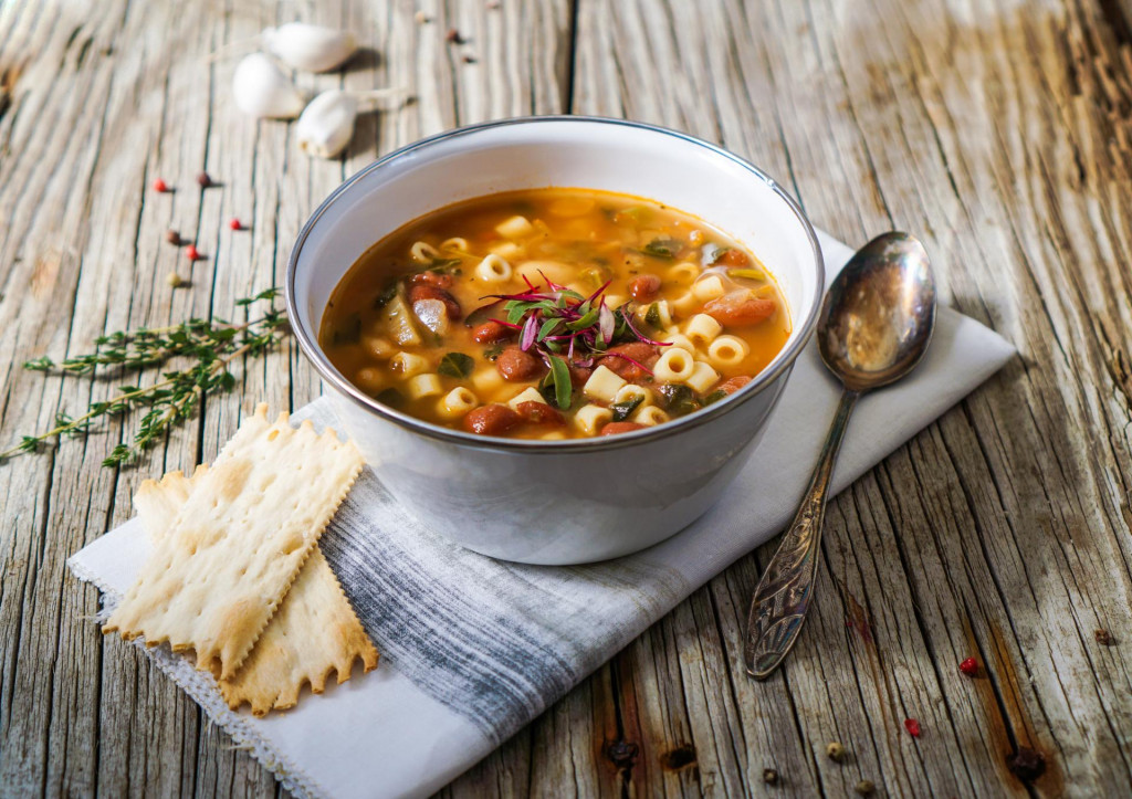 &lt;p&gt;A bowl of minestrone soup with crackers on rustic/ vintage background&lt;/p&gt;