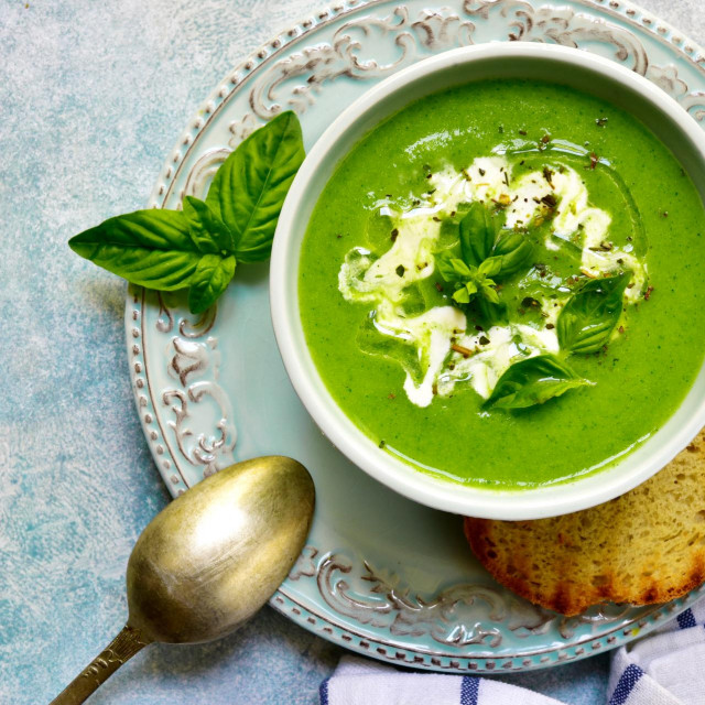 &lt;p&gt;Healthy broccoli soup in a bowl over light blue slate, stone or concrete background.Top view with copy space.&lt;/p&gt;