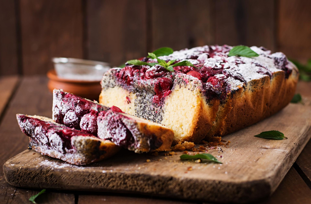 &lt;p&gt;Cherry poppy seed cake dusted with powdered sugar on a wooden table&lt;/p&gt;