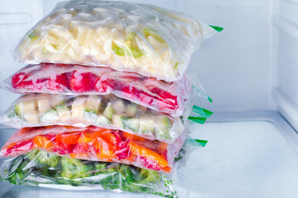 &lt;p&gt;Bags with frozen vegetables in refrigerator, closeup&lt;/p&gt;