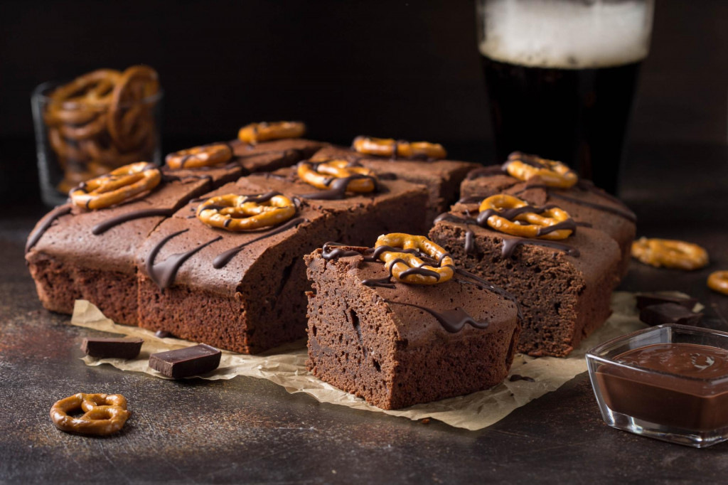 &lt;p&gt;Chocolate brownie on dark beer with salted pretzels and chocolate. Delicious brutal dessert for men, sweet food&lt;/p&gt;
