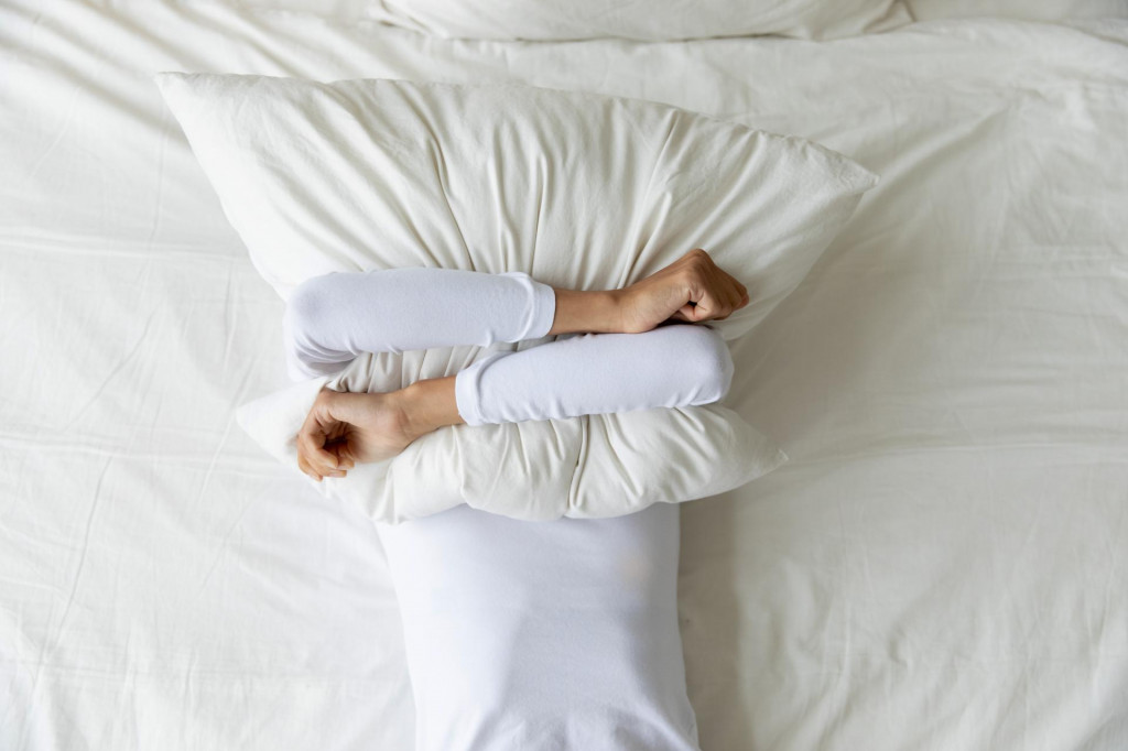&lt;p&gt;Top view depressed woman covering face with pillow, lying on bed at home alone, frustrated unhappy young female suffering from insomnia, mental or relationship problems, break up or divorce&lt;/p&gt;