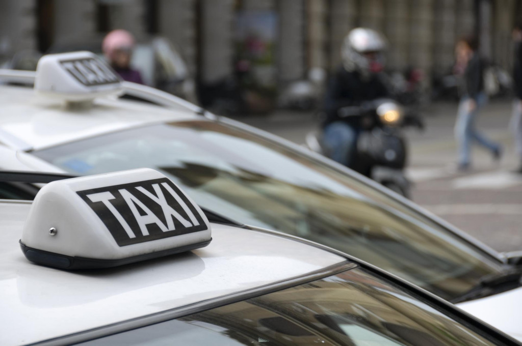 &lt;p&gt;Taxi sign on a cab&lt;/p&gt;