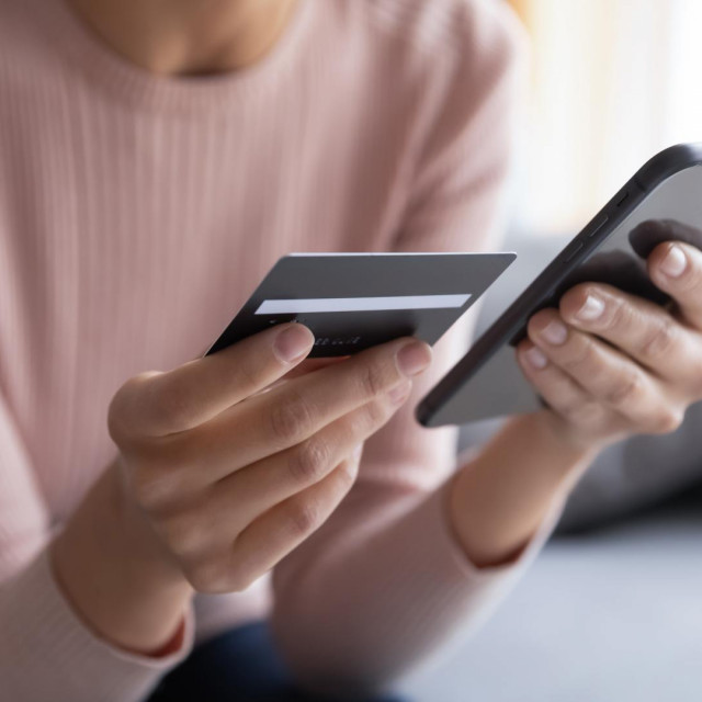&lt;p&gt;Close up female hands holding credit card and smartphone, young woman paying online, using banking service, entering information, shopping, ordering in internet store, doing secure payment&lt;/p&gt;