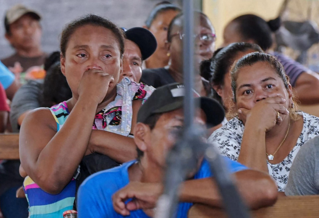 &lt;p&gt;Relatives and friends of the victims of a fire on the eve that killed at least 19 youths and injured about 20 others in a schoolgirls‘ dormitory, cry during a meeting with Guyana‘s President Irfaan Ali, in Mahdia, Guyana, on May 22, 2023. At least 19 youths were killed in a schoolgirls‘ dormitory blaze in Guyana. It is not yet known how the fire started on Sunday in a dormitory housing girls aged 11-12 and 16-17, a person who helped the emergency services said under condition of anonymity. The building was gutted by the inferno. (Photo by Keno GEORGE/AFP)&lt;/p&gt;