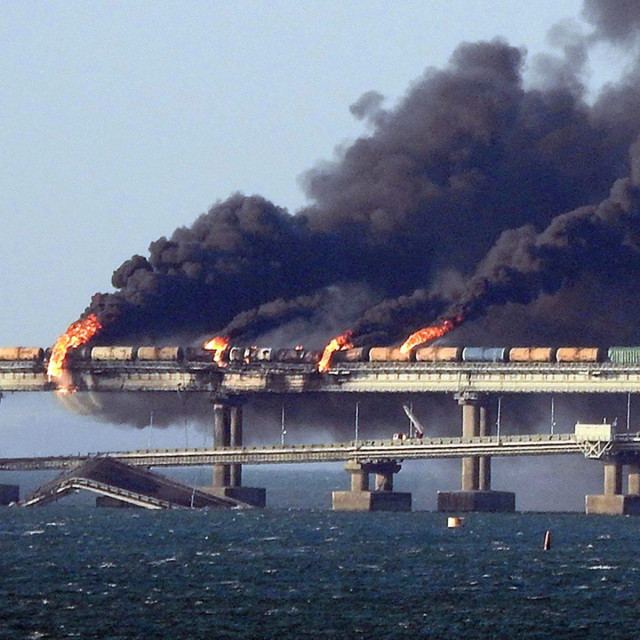 &lt;p&gt;(FILES) In this file photo taken on October 08, 2022 black smoke billows from a fire on the Kerch bridge that links Crimea to Russia, after a truck exploded, near Kerch. The Russian-built Crimean bridge linking mainland Russia and Moscow-annexed Crimea was personally inaugurated by Russian President Vladimir Putin five years ago on May 15, 2018. In October 2022, it was partially destroyed by a truck bomb in an attack Moscow blamed on Ukraine, an accusation Kyiv denies. The bridge serves as a vital link for transporting supplies to Russian soldiers in Ukraine. Built at a cost of 228 billion rubles ($3.7 billion), the structure connects the southern Krasnodar region with the Crimean city of Kerch, spanning a strait between the Black and Azov seas. (Photo by AFP)&lt;/p&gt;