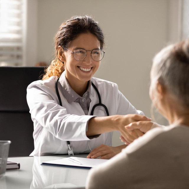 &lt;p&gt;Close up smiling female doctor wearing glasses and uniform with stethoscope shaking mature woman hand at meeting, elderly patient making health insurance deal, older generation healthcare concept&lt;/p&gt;