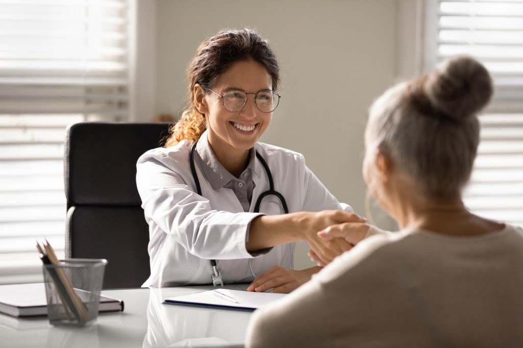 &lt;p&gt;Close up smiling female doctor wearing glasses and uniform with stethoscope shaking mature woman hand at meeting, elderly patient making health insurance deal, older generation healthcare concept&lt;/p&gt;