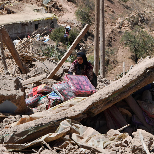 &lt;p&gt;A woman searches for belongings in the rubble of a house in the village of Tiksit, south of Adassil, on September 10, 2023, two days after a devastating 6.8-magnitude earthquake struck the country. Moroccans on September 10 mourned the victims of a devastating earthquake that killed more than 2,000 people as rescue teams raced to find survivors trapped under the rubble of flattened villages. (Photo by Fethi Belaid/AFP)&lt;/p&gt;
