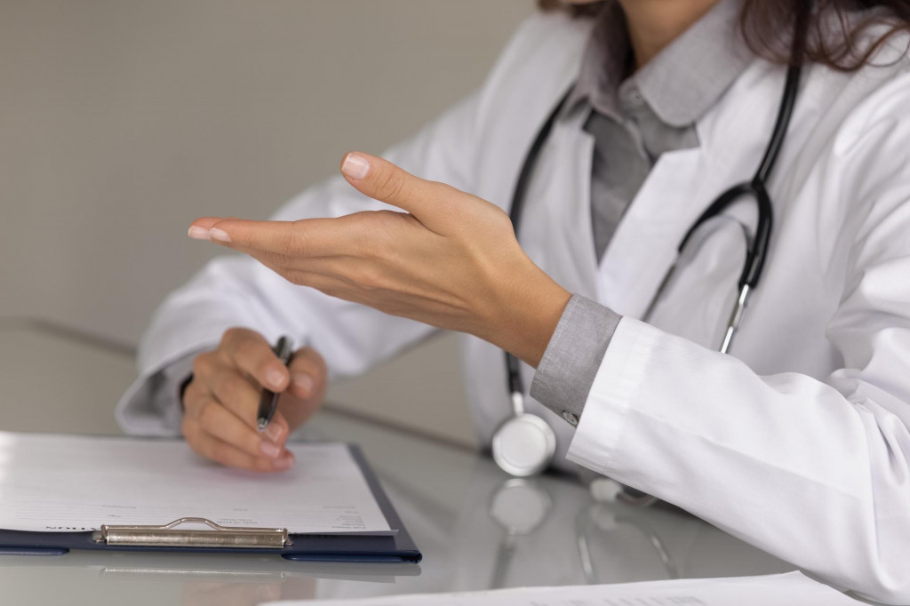 &lt;p&gt;Close up hands of female doctor wearing uniform with stethoscope consulting patient, filling medical document, patient card on clipboard, explaining treatment, prescriptions, giving recommendations&lt;/p&gt;
