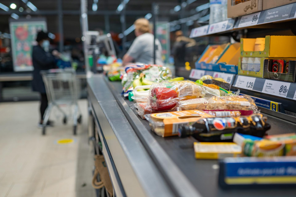 &lt;p&gt;Groceries shopping at Lidl, checkout cashier counter belt full of groceries at supermarket. Shopping with social distancing measures in stores. SWANSEA, UK - MARCH 31, 2021&lt;/p&gt;