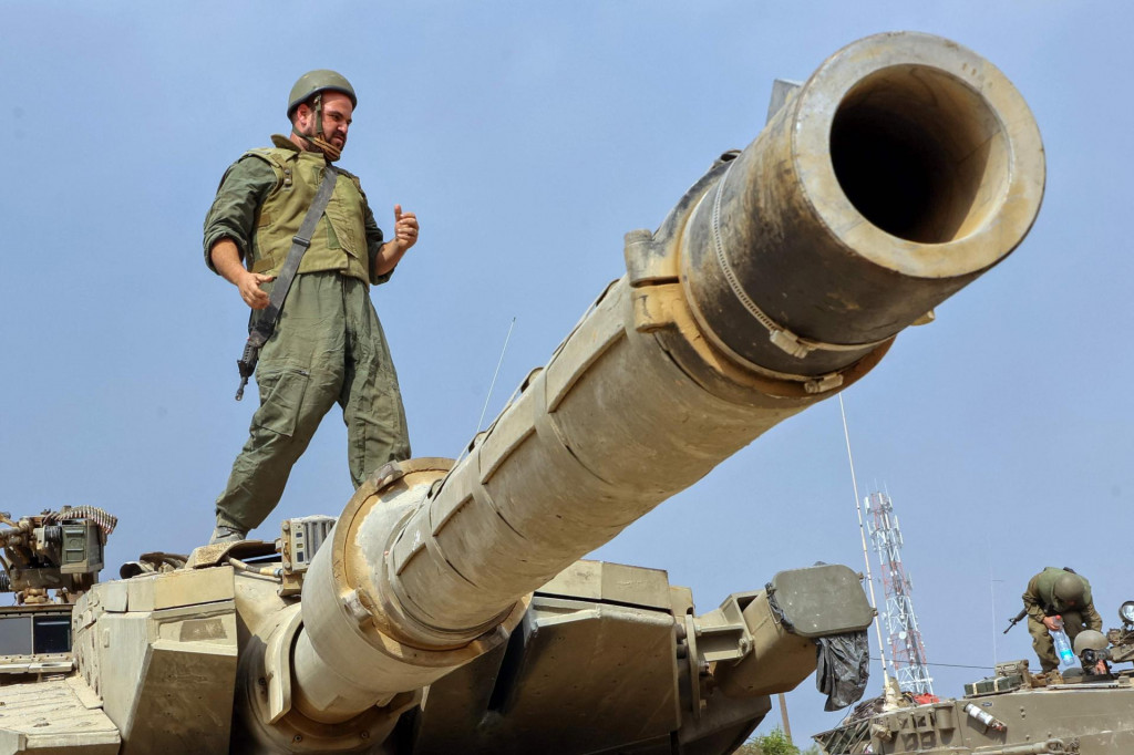 &lt;p&gt;A soldier stands on the turret of a tank as Israeli forces take positions near the city of Sderot near the border with Gaza on October 11, 2023. Israel declared war on Hamas on October 8 following a shock land, air and sea assault by the Gaza-based Islamists. The death toll from the shock cross-border assault by Hamas militants rose to 1,200, making it the deadliest attack in the country‘s 75-year history, while Gaza officials reported more than 1,000 people killed as Israel pounded the territory with air strikes. (Photo by GIL COHEN-MAGEN/AFP)&lt;/p&gt;