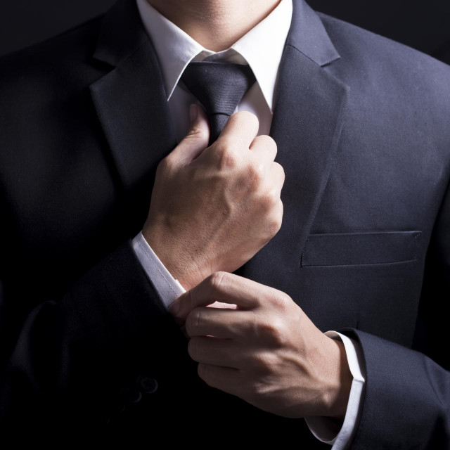 &lt;p&gt;Businessman Adjust Necktie his Suit&lt;/p&gt;