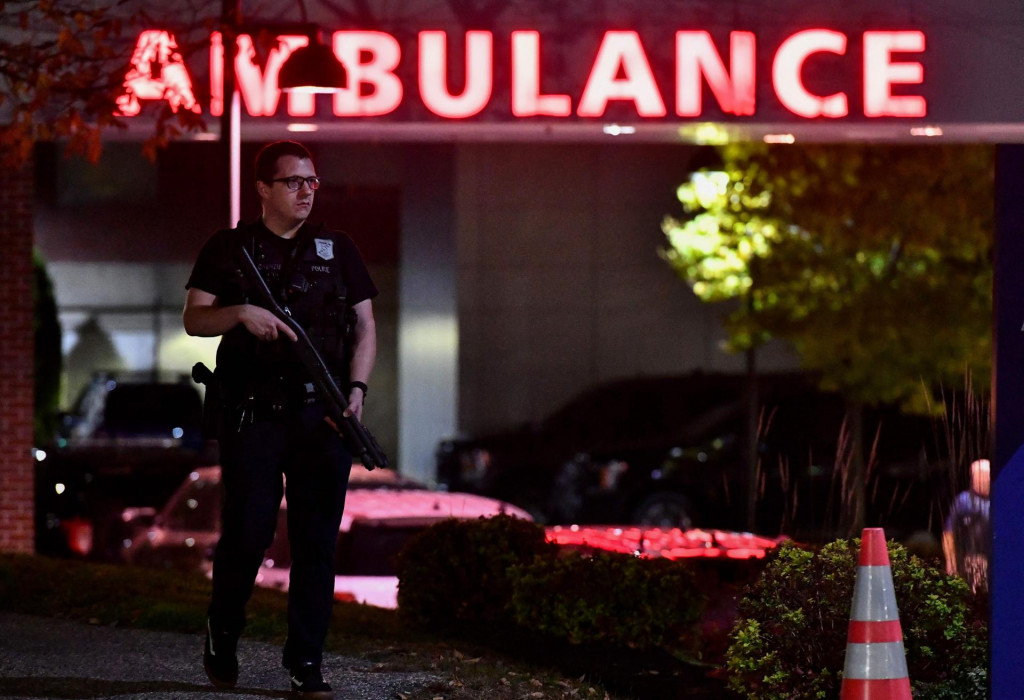 &lt;p&gt;An armed police officer guards the ambulance entrance to the Central Maine Medical Center in Lewiston, Maine early on October 26, 2023. A massive manhunt was under way on October 26 for a gunman who a local official said killed at least 22 people and wounded dozens more in mass shootings in the US state of Maine, the deadliest such incident this year. (Photo by Joseph Prezioso/AFP)&lt;/p&gt;