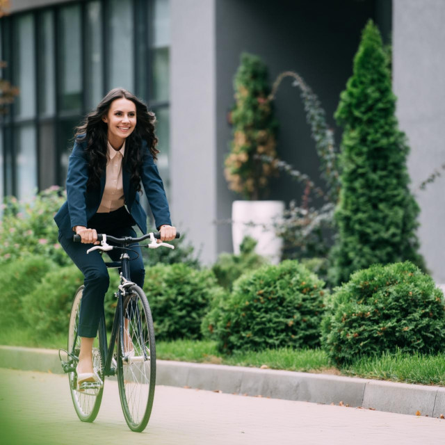 &lt;p&gt;Young happy businesswoman riding bicycle&lt;/p&gt;