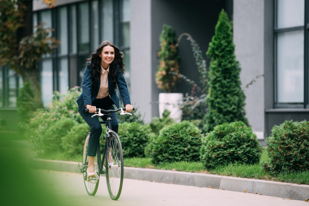 &lt;p&gt;Young happy businesswoman riding bicycle&lt;/p&gt;