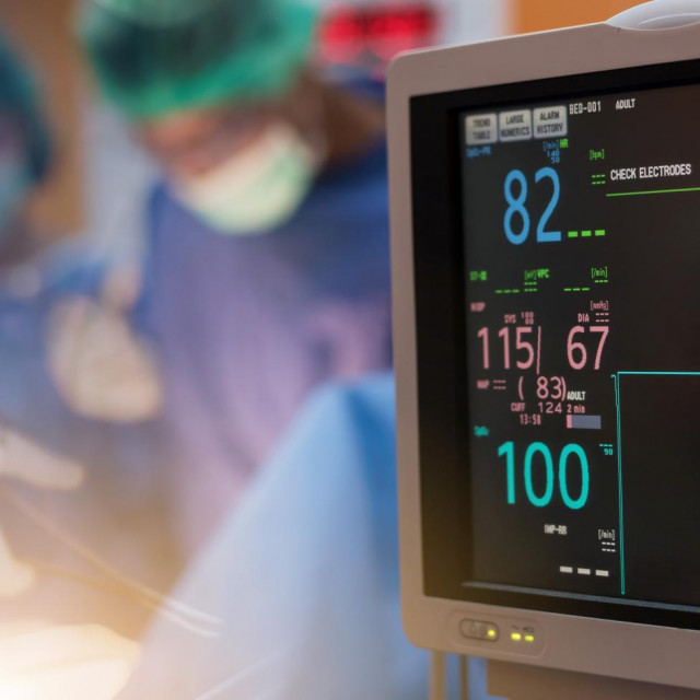 &lt;p&gt;Team of doctors or surgeons with electrocardiogram monitor in hospital surgery operating emergency room showing patient heart rate, during coronavirus or covid-19 crisis, medical concept.&lt;/p&gt;