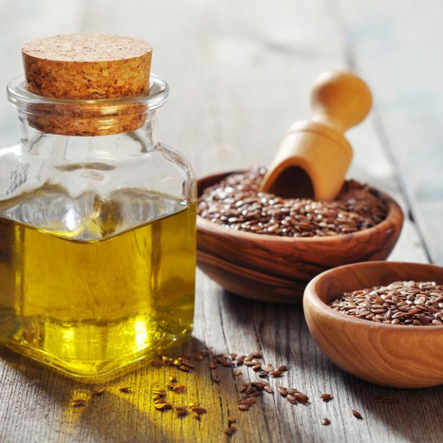 &lt;p&gt;Flax seeds and oil in bottle on wooden background&lt;/p&gt;