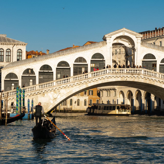 &lt;p&gt;A typical gondola boat next to Rialto bridge is seen in Venice, Italy, on January 30th, 2024. Gondolas are traditional, flat-bottomed rowing boats that are iconic to the city of Venice. These slender, handcrafted boats are typically operated by a gondolier who skillfully navigates through the intricate network of canals in Venice. Gondolas are known for their elegant and distinctive design, featuring a curved prow, ornate decorations, and a flat hull. Rialto Bridge in Venice is one of the iconic landmarks in the city. The bridge, with its distinctive architecture featuring a central portico and shops along its length, is a popular destination for tourists and locals alike. (Photo by Lorenzo Di Cola/NurPhoto) (Photo by Lorenzo Di Cola/NurPhoto/NurPhoto via AFP)&lt;/p&gt;