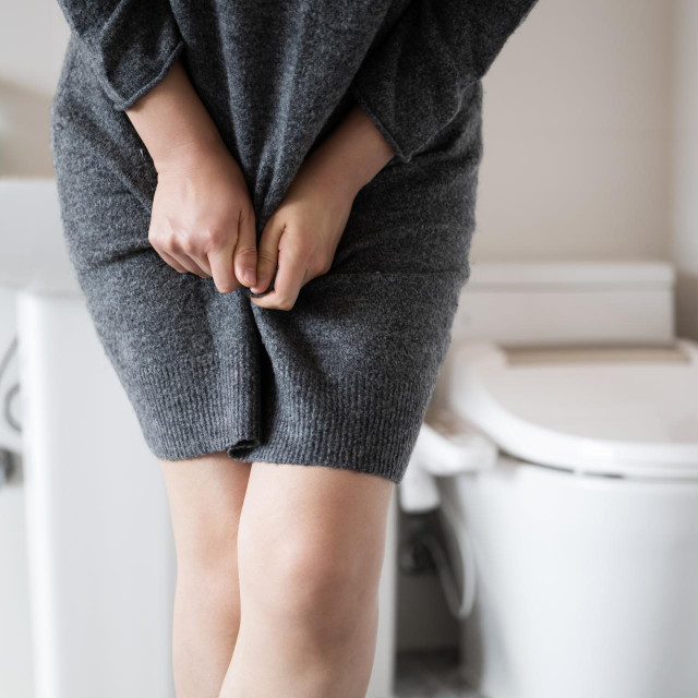 &lt;p&gt;A woman wearing knitwear is complaining of pain from urinary incontinence in front of the toilet&lt;/p&gt;