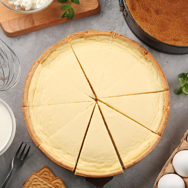 &lt;p&gt;Composition with tasty cheesecake on grey table&lt;/p&gt;