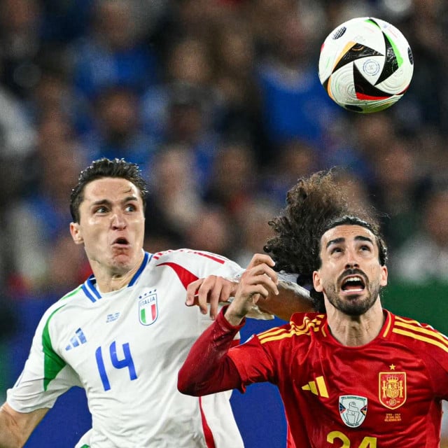 &lt;p&gt;Spain‘s defender #24 Marc Cucurella (R) fights for the ball with Italy‘s forward #14 Federico Chiesa during the UEFA Euro 2024 Group B football match between Spain and Italy at the Arena AufSchalke in Gelsenkirchen on June 20, 2024. (Photo by OZAN KOSE/AFP)&lt;/p&gt;
