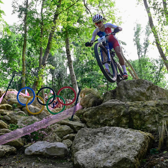 &lt;p&gt;France‘s Loana Lecomte competes in the women‘s cross-country mountain biking event during the Paris 2024 Olympic Games in Elancourt Hill venue in Elancourt, on July 28, 2024. (Photo by John MACDOUGALL/AFP)&lt;/p&gt;