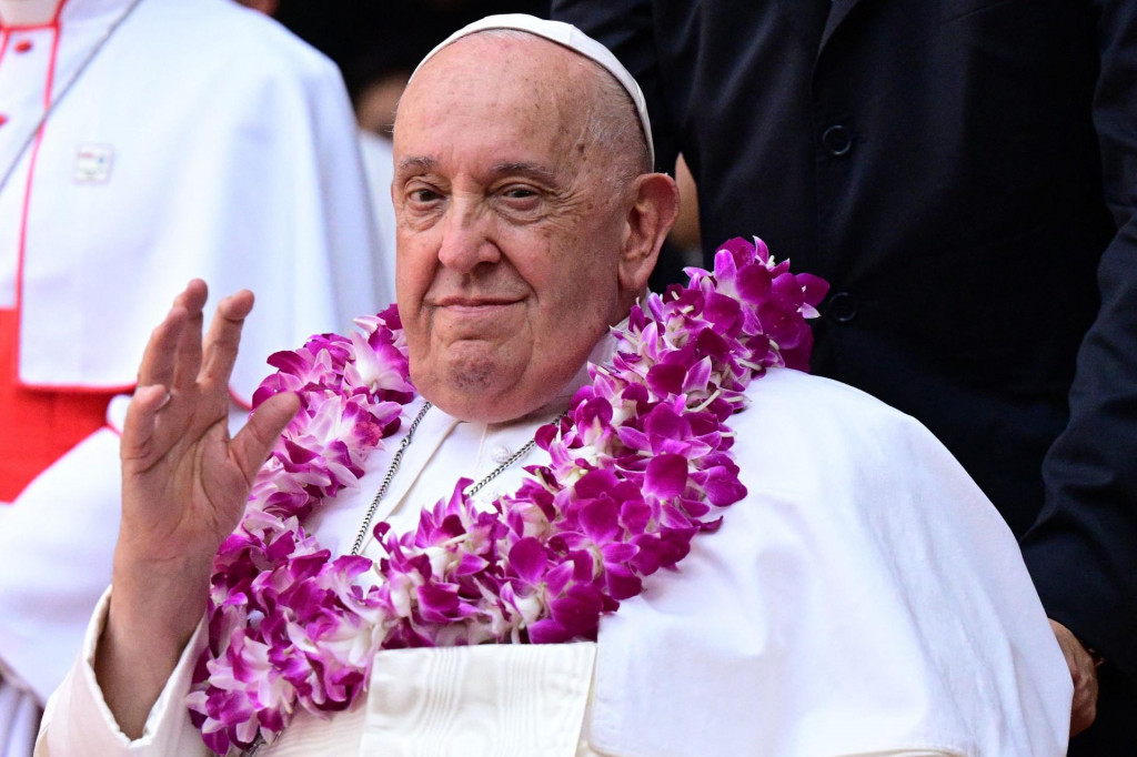 &lt;p&gt;Pope Francis wears a flower garland as he arrives for an interreligious meeting with young people at the Catholic Junior College in Singapore on September 13, 2024. Singapore is the last stop on the pope‘s 12-day, four-nation Asia-Pacific trip aimed at boosting the Catholic Church‘s standing in the world‘s most populous region. (Photo by Tiziana FABI/AFP)&lt;/p&gt;