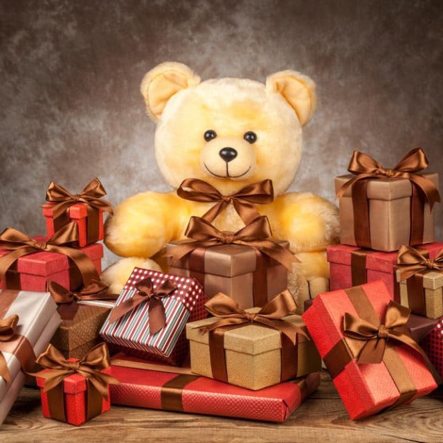 &lt;p&gt;homemade teddy bear and a lot of boxes with gifts on the old board.&lt;/p&gt;