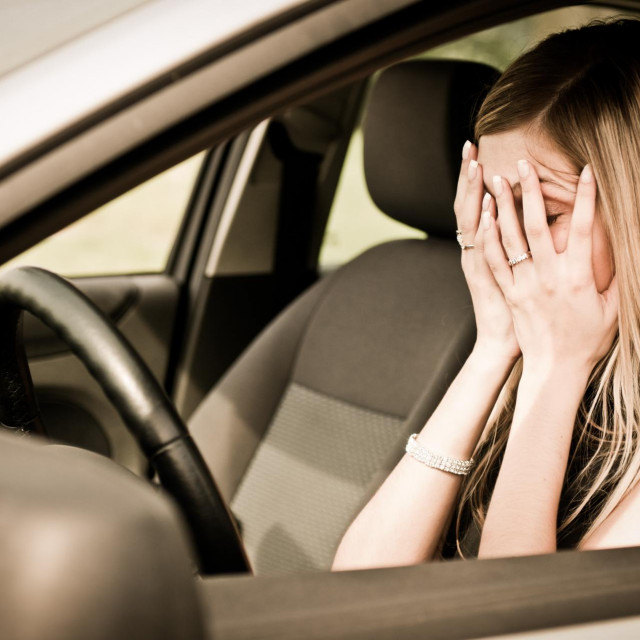 &lt;p&gt;Young woman with hands on eyes sitting depressed in car&lt;/p&gt;